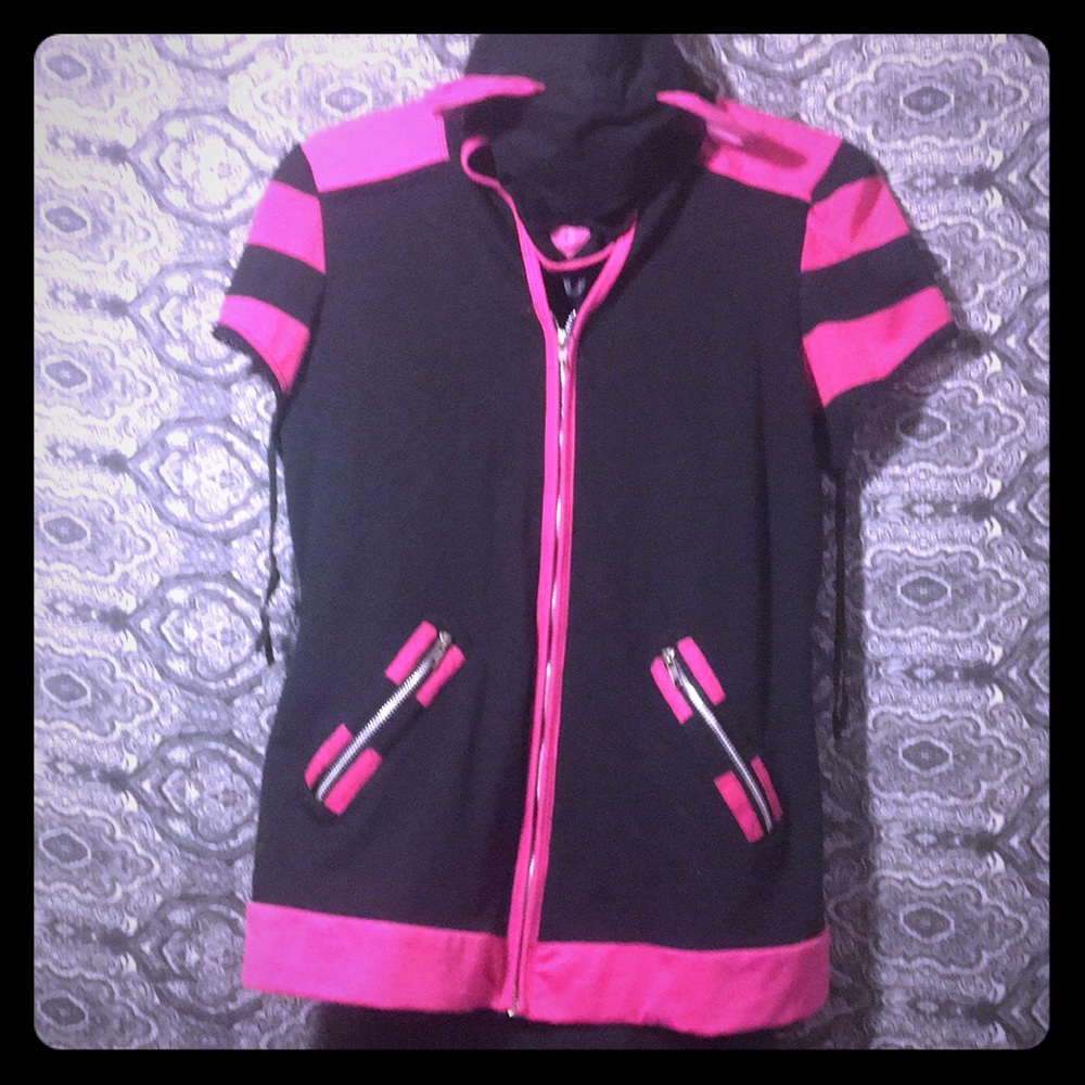 Cat face hood over jacket/black dress.